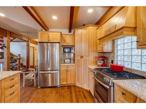 100-352246 242 Avenue West, Rural Foothills County, AB - Indoor Photo Showing Kitchen With Stainless Steel Kitchen