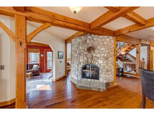 100-352246 242 Avenue West, Rural Foothills County, AB - Indoor Photo Showing Living Room With Fireplace