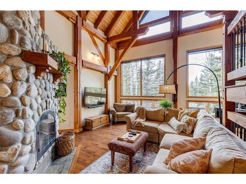 100-352246 242 Avenue West, Rural Foothills County, AB - Indoor Photo Showing Living Room With Fireplace