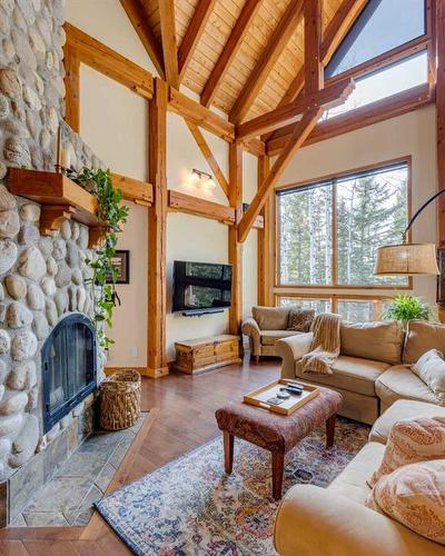 100-352246 242 Avenue West, Rural Foothills County, AB - Indoor Photo Showing Living Room With Fireplace