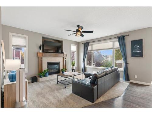 421 River Heights Drive, Cochrane, AB - Indoor Photo Showing Living Room With Fireplace