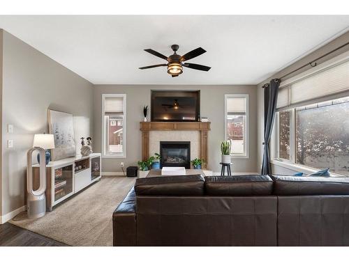 421 River Heights Drive, Cochrane, AB - Indoor Photo Showing Living Room With Fireplace