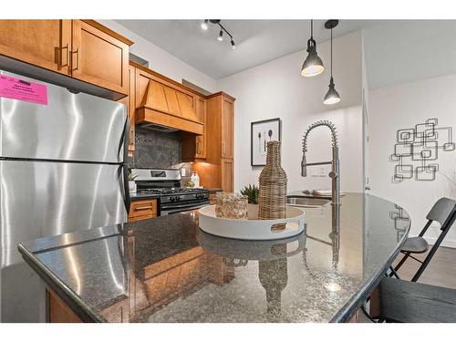 101-1818 14 Street Sw, Calgary, AB - Indoor Photo Showing Kitchen With Stainless Steel Kitchen