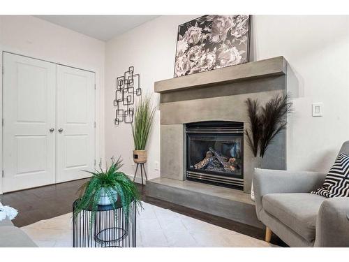 101-1818 14 Street Sw, Calgary, AB - Indoor Photo Showing Living Room With Fireplace