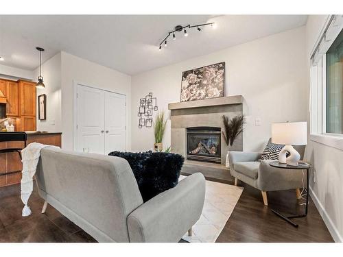 101-1818 14 Street Sw, Calgary, AB - Indoor Photo Showing Living Room With Fireplace