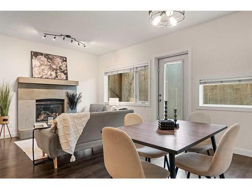 101-1818 14 Street Sw, Calgary, AB - Indoor Photo Showing Dining Room With Fireplace