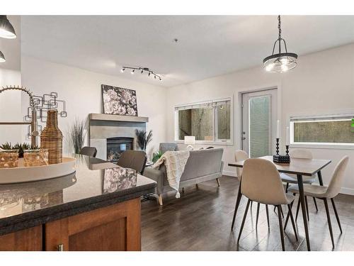 101-1818 14 Street Sw, Calgary, AB - Indoor Photo Showing Dining Room With Fireplace