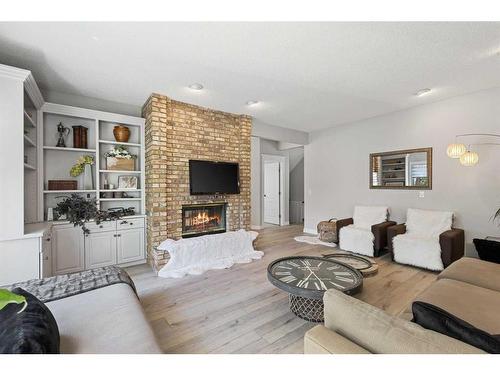 145 Candle Place Sw, Calgary, AB - Indoor Photo Showing Living Room With Fireplace