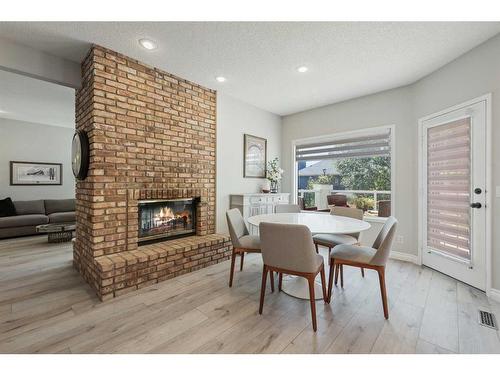 145 Candle Place Sw, Calgary, AB - Indoor Photo Showing Other Room With Fireplace