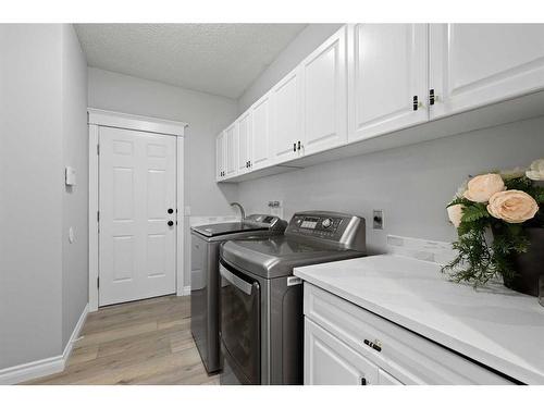 145 Candle Place Sw, Calgary, AB - Indoor Photo Showing Laundry Room