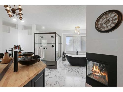 145 Candle Place Sw, Calgary, AB - Indoor With Fireplace