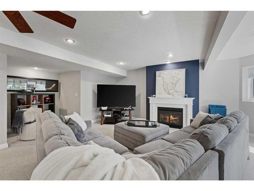 145 Candle Place Sw, Calgary, AB - Indoor Photo Showing Other Room With Fireplace