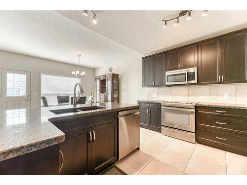 113 Everhollow Rise Sw, Calgary, AB - Indoor Photo Showing Kitchen With Stainless Steel Kitchen With Double Sink