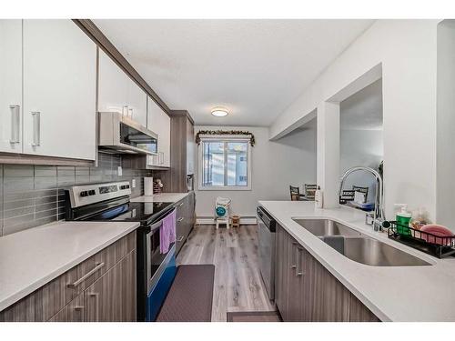 304-4328 4 Street Nw, Calgary, AB - Indoor Photo Showing Kitchen With Double Sink With Upgraded Kitchen