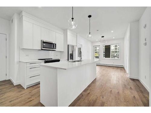 3113-111 Wolf Creek Drive Se, Calgary, AB - Indoor Photo Showing Kitchen With Double Sink With Upgraded Kitchen