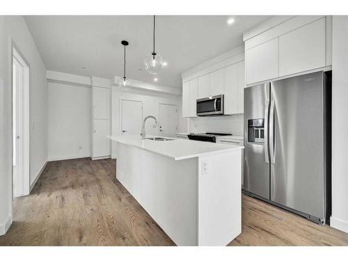 3113-111 Wolf Creek Drive Se, Calgary, AB - Indoor Photo Showing Kitchen With Stainless Steel Kitchen With Upgraded Kitchen