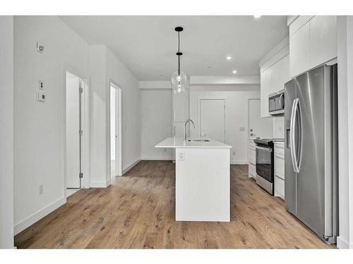 3113-111 Wolf Creek Drive Se, Calgary, AB - Indoor Photo Showing Kitchen With Stainless Steel Kitchen