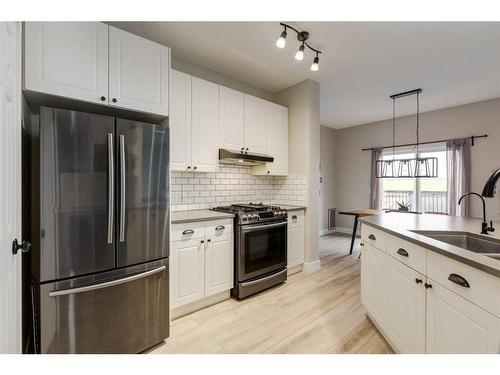 73 Crystal Shores Crescent, Okotoks, AB - Indoor Photo Showing Kitchen With Stainless Steel Kitchen With Upgraded Kitchen