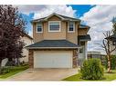 73 Crystal Shores Crescent, Okotoks, AB  - Outdoor With Facade 