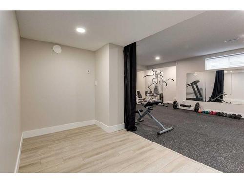 73 Crystal Shores Crescent, Okotoks, AB - Indoor Photo Showing Gym Room