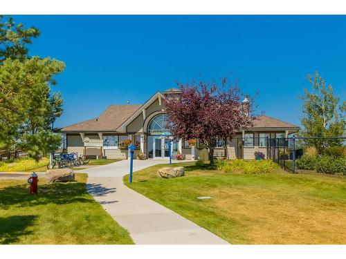 73 Crystal Shores Crescent, Okotoks, AB - Outdoor With Facade