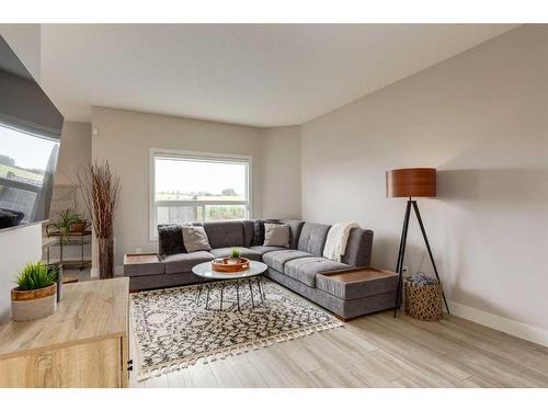 73 Crystal Shores Crescent, Okotoks, AB - Indoor Photo Showing Living Room