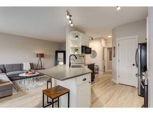 73 Crystal Shores Crescent, Okotoks, AB - Indoor Photo Showing Kitchen With Double Sink