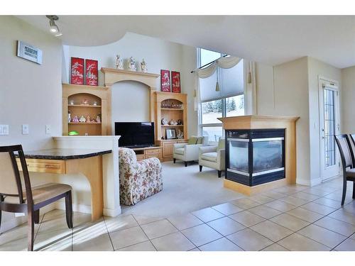 4642 Hamptons Way Nw, Calgary, AB - Indoor Photo Showing Living Room With Fireplace