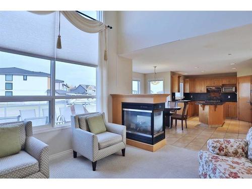 4642 Hamptons Way Nw, Calgary, AB - Indoor Photo Showing Living Room With Fireplace