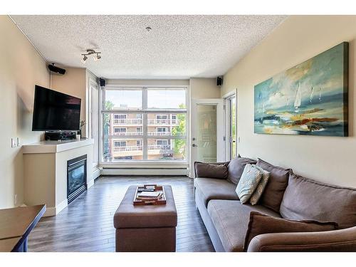 320-315 24 Avenue Sw, Calgary, AB - Indoor Photo Showing Living Room With Fireplace