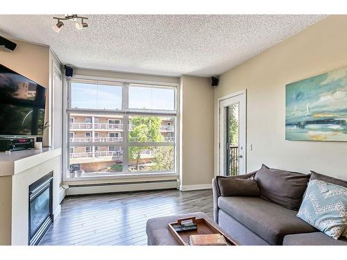 320-315 24 Avenue Sw, Calgary, AB - Indoor Photo Showing Living Room With Fireplace