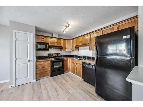 90 Copperfield Court Se, Calgary, AB - Indoor Photo Showing Kitchen