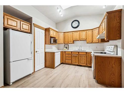 2 Wellington Cove, Strathmore, AB - Indoor Photo Showing Kitchen With Double Sink