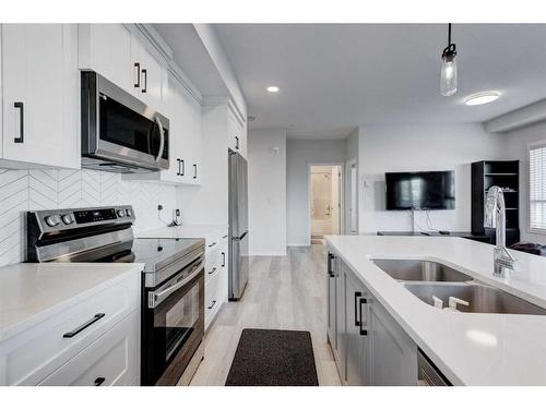 1102-19489 Main Street Se, Calgary, AB - Indoor Photo Showing Kitchen With Double Sink