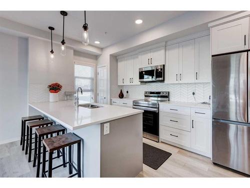 1102-19489 Main Street Se, Calgary, AB - Indoor Photo Showing Kitchen With Double Sink With Upgraded Kitchen