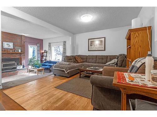 97 Fielding Drive Se, Calgary, AB - Indoor Photo Showing Living Room With Fireplace