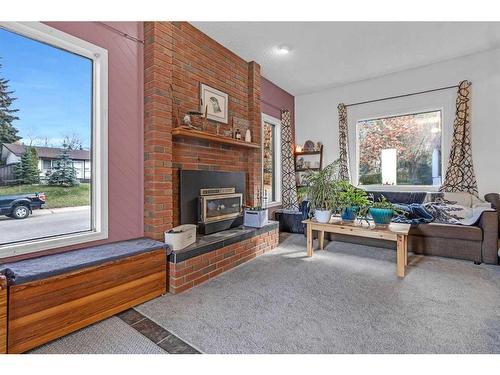 97 Fielding Drive Se, Calgary, AB - Indoor Photo Showing Living Room With Fireplace