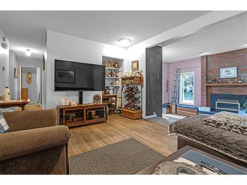 97 Fielding Drive Se, Calgary, AB - Indoor Photo Showing Living Room With Fireplace