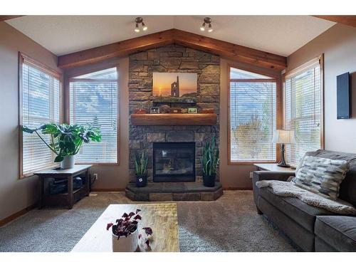 35 Tuscany Reserve Court Nw, Calgary, AB - Indoor Photo Showing Living Room With Fireplace