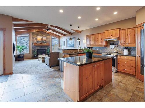 35 Tuscany Reserve Court Nw, Calgary, AB - Indoor Photo Showing Kitchen With Fireplace