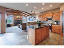 35 Tuscany Reserve Court Nw, Calgary, AB  - Indoor Photo Showing Kitchen With Fireplace 