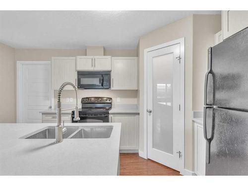 2101-2781 Chinook Winds Drive Sw, Airdrie, AB - Indoor Photo Showing Kitchen With Double Sink With Upgraded Kitchen