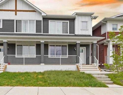 225 Creekside Drive Sw, Calgary, AB - Outdoor With Deck Patio Veranda With Facade