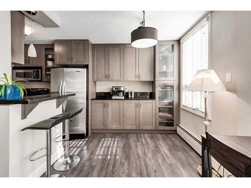 103-733 14 Avenue Sw, Calgary, AB - Indoor Photo Showing Kitchen With Stainless Steel Kitchen