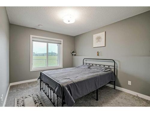 32 Legacy Cove Se, Calgary, AB - Indoor Photo Showing Bedroom