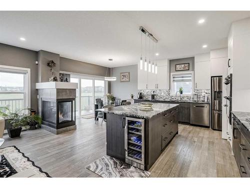 32 Legacy Cove Se, Calgary, AB - Indoor Photo Showing Kitchen With Fireplace With Upgraded Kitchen