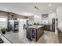 32 Legacy Cove Se, Calgary, AB  - Indoor Photo Showing Kitchen With Fireplace With Upgraded Kitchen 