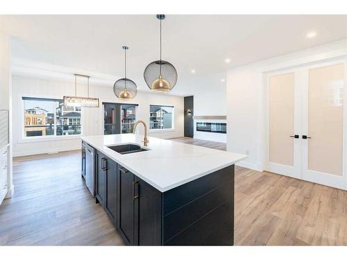 76 Sunvalley Way, Cochrane, AB - Indoor Photo Showing Kitchen With Double Sink With Upgraded Kitchen