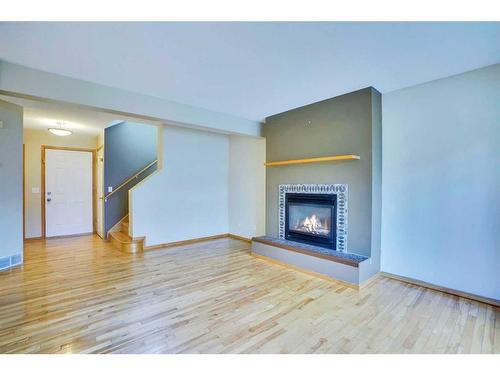 26 Citadel Peak Mews Nw, Calgary, AB - Indoor Photo Showing Living Room With Fireplace