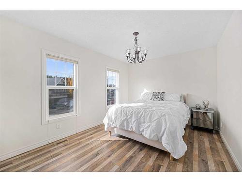 30 Riviera View South, Cochrane, AB - Indoor Photo Showing Bedroom